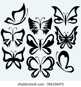 Set symbol butterflies. Isolated on blue background. Vector silhouettes