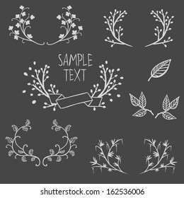 Set of symmetrical floral graphic design elements