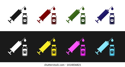 Set Syringe with pet vaccine icon isolated on black and white background. Dog or cat paw print. Vector Illustration