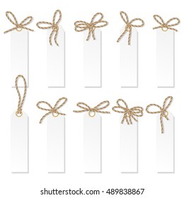 Set of tag labels with rope bakers twine bows on white background