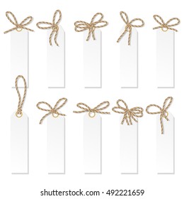 Set of tag labels with rope bakers twine bows on white background