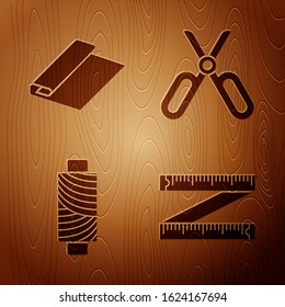 Set Tape measure, Textile fabric roll, Sewing thread on spool and Scissors on wooden background. Vector