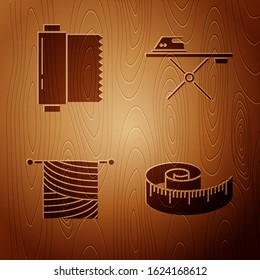 Set Tape measure, Textile fabric roll, Knitting and Electric iron and ironing board on wooden background. Vector