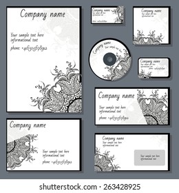 Set of templates for cd disks, envelopes, notebooks, credit card, business card and invitation card with floral ornament. Corporate style vector.