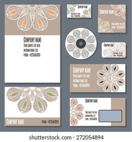 Set of templates for cd disks, envelopes, notebooks, credit card, business card and invitation card with floral ornament. Corporate style vector.