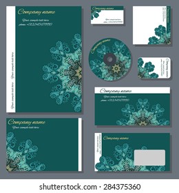 Set of templates for cd disks, envelopes, notebooks, credit card, business card and invitation card with floral ornament. Corporate style vector.