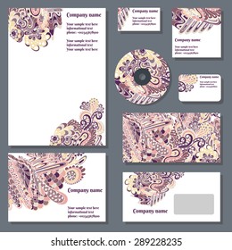 Set of templates for cd disks, envelopes, notebooks, credit card, business card and invitation card with doodle ornament. Corporate style vector.