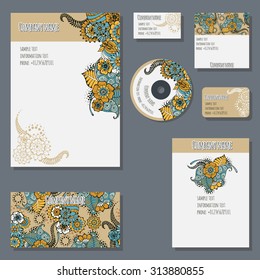 Set of templates for cd disks, envelopes, notebooks, credit card, business card and invitation card with floral ornament. Corporate style vector.