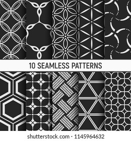 Set of ten monochrome seamless patterns. Abstract geometrical trendy vector backgrounds. Fashion design. Modern stylish textures with stylized flowers, hexagons, symmetric geometric shapes.