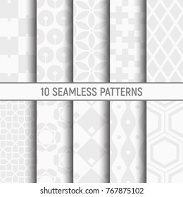 Set of ten seamless patterns. Abstract geometrical trendy vector backgrounds. Modern stylish textures with repeating geometric square tiles, rhombuses, hexagons, crosses. White and gray textures.