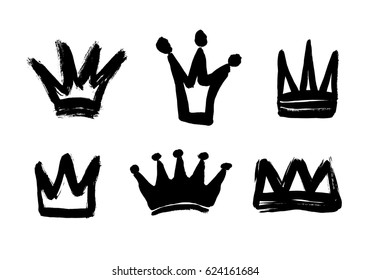 Set texture strokes thick paint in the form of a crown isolated on white background. Set of black hand drawn crowns. Vector Illustrations.