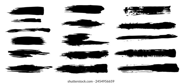 A set of textured dry brush strokes, abstract spots, blots, splashes and scuffs. Vector graphics.
