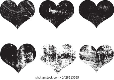 Set of textured vector valentine hearts. Decorative design elements. Distressed symbols of love. Textured Valentine's Day signs. Vector illustration. Black hearts isolated on white. EPS10.