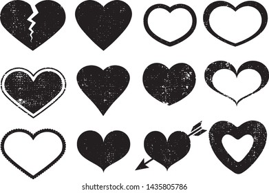 Set of textured vector valentine hearts. Decorative design elements. Distressed symbols of love. Textured Valentine's Day signs. Vector illustration. Black hearts isolated on white. EPS10.