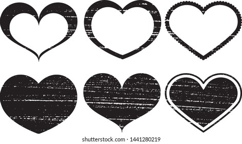 Set of textured vector valentine hearts. Decorative design elements. Distressed symbols of love. Textured Valentine's Day signs. Vector illustration. Black hearts isolated on white. EPS10.