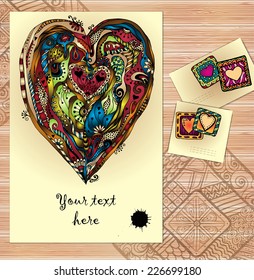 Set of three abstract doodle ethnic tribal hand drawn vector love cards on wood background. Paisley heart sketch invite. Series of template frame design for card. Used clipping mask for easy editing.
