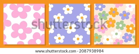 Set of three abstract square seamless patterns with vintage groovy daisy flowers. Retro floral vector background surface design, textile, stationery, wrapping paper, covers. 60s, 70s, 80s style