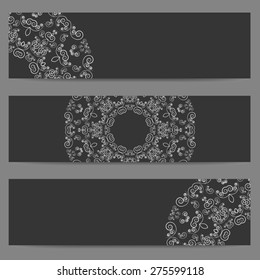 Set of three black banners decorated with ornate lacy pattern