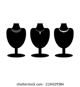 Set of three black mannequin silhouettes with different diamond necklace