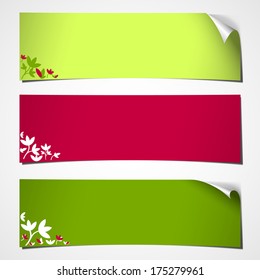 set of three blank banners with curled corner colored for spring with flower decor