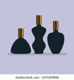 Set of three bottles of various shapes with gold caps