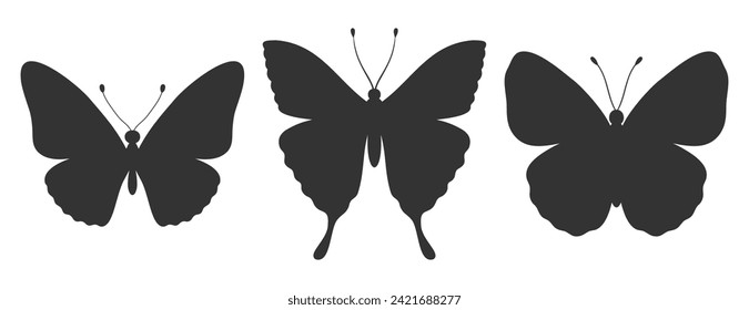 Set of three butterfly silhouettes. Insect icons, tattoos. Simple black shapes of butterflies and moths. Vector illustration