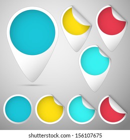set of three curled tag and circles colored blue, yellow and red, orange for winter