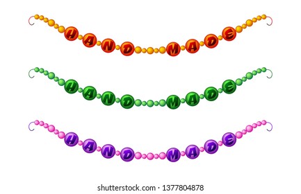 Set of three different colored beads with the inscription Hand Made on white background