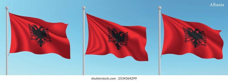 Conjunto de tres banderas de Albania ondeando en los mástiles con un fondo de cielo azul vibrante.