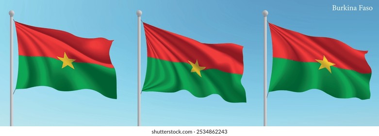 Set of three flags of Burkina Faso waving on flagpoles with a vibrant blue sky backdrop.