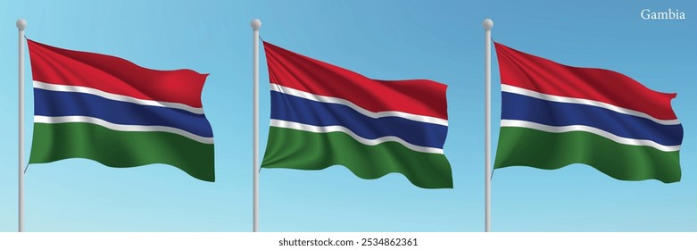 Set of three flags of Gambia waving on flagpoles with a vibrant blue sky backdrop.