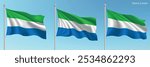 Set of three flags of Sierra Leone waving on flagpoles with a vibrant blue sky backdrop.