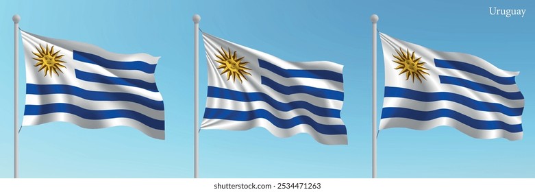 Conjunto de tres banderas de Uruguay ondeando sobre mástiles con un fondo azul vibrante del cielo.