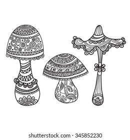 Set of three fungi isolated in the style of doodle, black and white graphics, isolated, painted by hand.