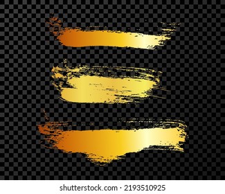 Satz von drei goldenen Pinselstrichen. Handgezeichnete Tintenflecken einzeln auf dunklem Hintergrund. Vektorgrafik
