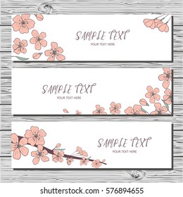 Set of three horizontal cards with hand-drawn sakura branch and sakura flowers on white background. Spring time banners.