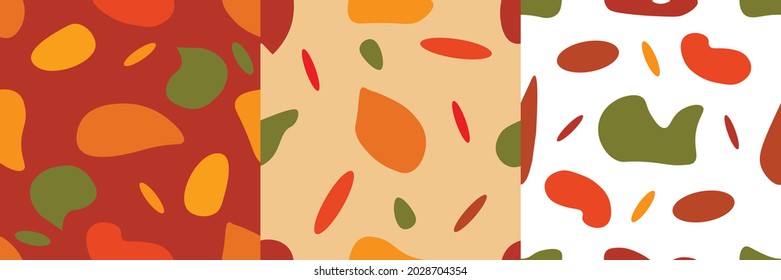 A set of three isolated abstract patterns with random spots in autumn color scheme. Vector illustration in modern style. Stamp texture, wallpaper collection. minimalist art.