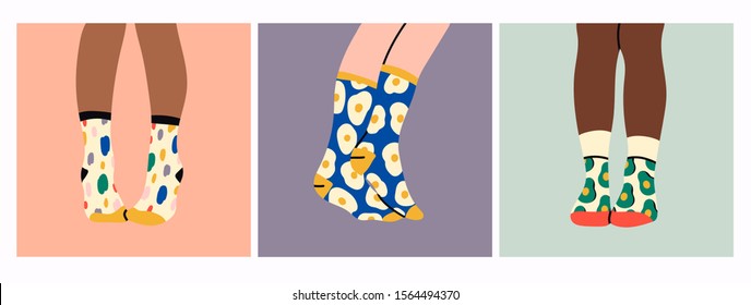 Set of three pairs of female or male legs in the socks. Cool various prints. Stylish underwear. Fashion accessories. Footwear. Hand drawn vector colored trendy illustration. Flat design