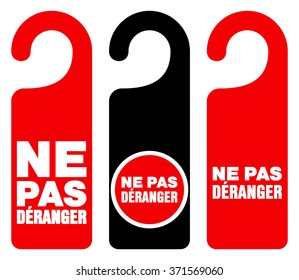 Set of three red, black and white door hang tag signs with do not disturb text as ne pas deranger - in English saying Do not disturb