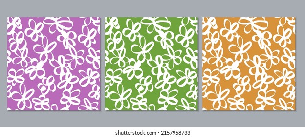 Conjunto de tres patrones florales abstractos sin fisuras. fondo violeta verde y naranja con flores dibujadas a mano blanca.
