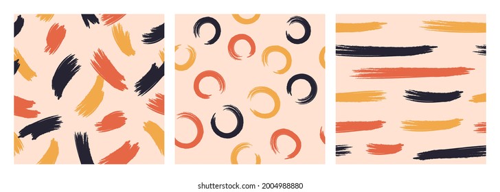 A set of three seamless abstract patterns depicting paint strokes. Design for paper, textiles and decor.