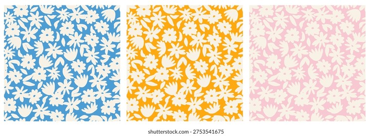 Set of three seamless floral patterns with white stylized flowers and leaves on blue, orange and soft pink backgrounds. Repeating botanical prints for fabric, wallpaper and textile projects.