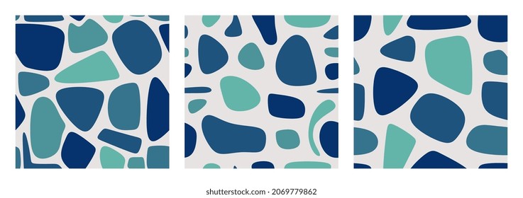 Set of three seamless patterns with abstract stains in blue colors.