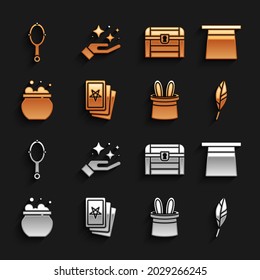 Set Three tarot cards, Magic hat, feather, Magician and rabbit ears, Witch cauldron, Antique treasure chest, hand mirror and Sparkle stars with magic trick icon. Vector