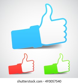 Set of three thumb up icons with soft shadows and different colors