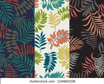 Set of three of tropical backgrounds with palm leaves. Seamless floral patterns. Summer vector illustrations. Flat jungle prints.