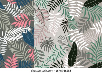 Set of three tropical backgrounds with palm leaves. Seamless floral patterns. Summer vector illustrations. Flat jungle prints