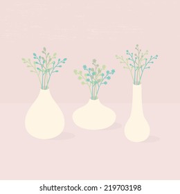Set of three vases with wildflowers in different shapes on pink textured background