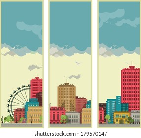 set of three vertical banners with cityscape on the background of sky 