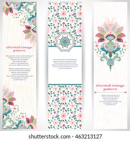 Set of three vertical banners with imitation of wooden texture and strokes on backdrop. Bright traditional oriental flowers. Place for your text.